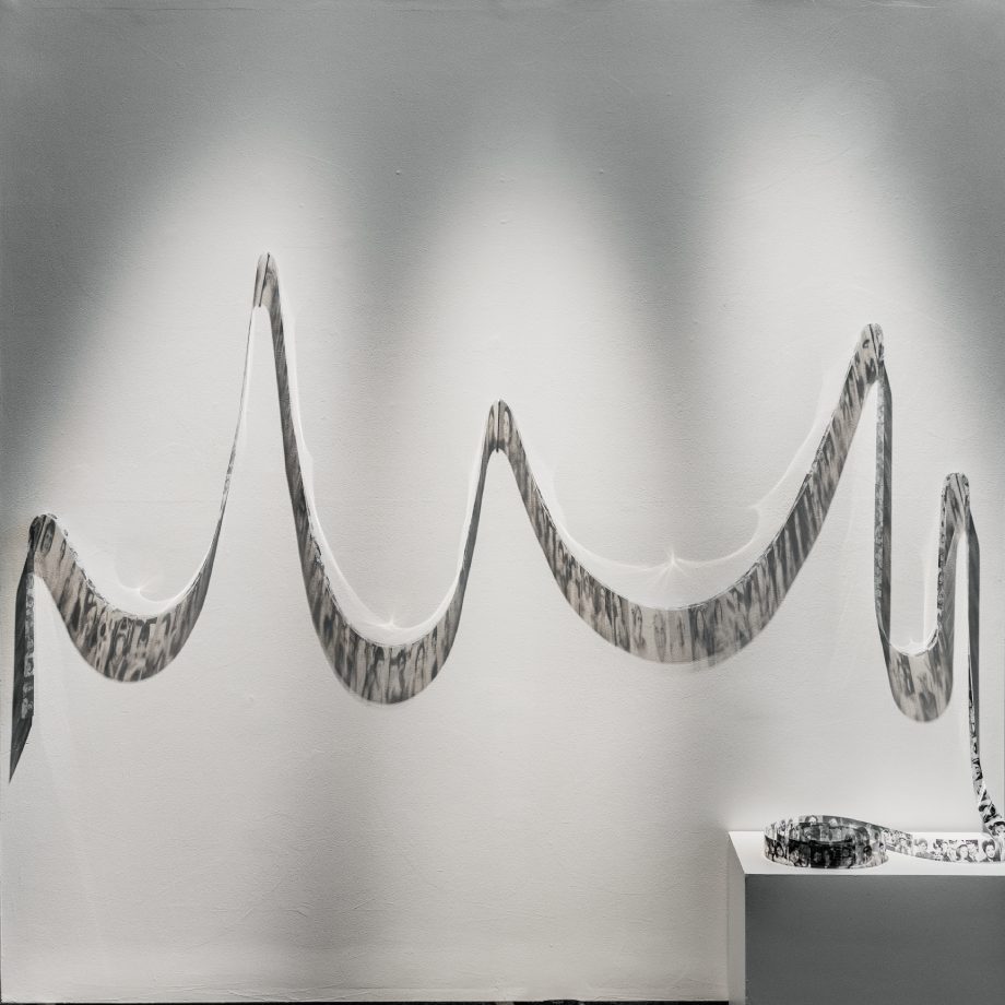 A spool of material, partially hung on a wall