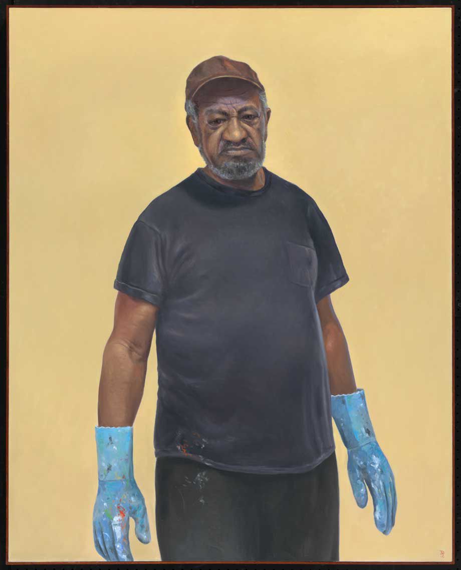 An oil painting of a middle-aged African American man in a black t-shirt and pants, with a brown ballcap on and wearing a pair of baby blue gloves. The gloves, and part of his shirt and pants are covered in paints of various colors.