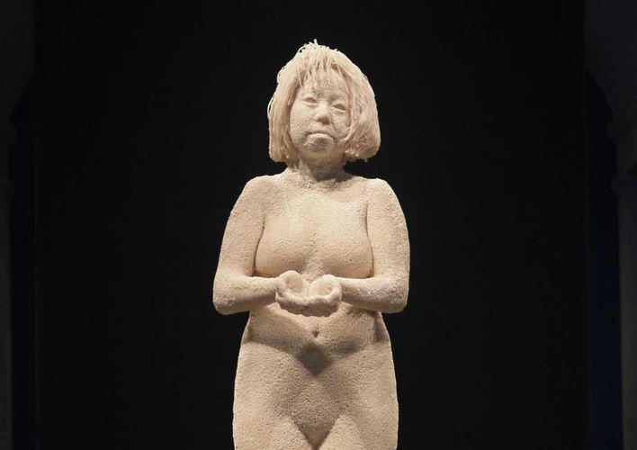 Statue of a woman with chin-length hair, made of rice and rice noodles.