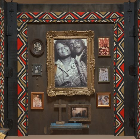 Framed photographs hung on a wall