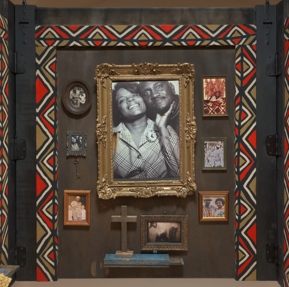 Framed photographs hung on a wall